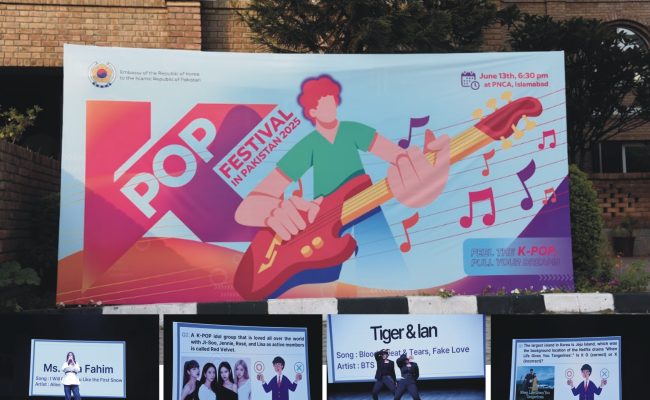 Young Pakistani performers and audience celebrating at the 2025 K-POP Festival hosted by the Korean Embassy in Islamabad.